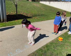 student preparing to jump along number line 